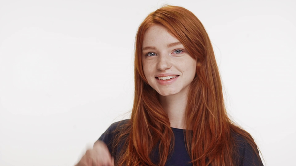 smiling-cute-redhead-caucasian-teenage-girl-showing-ok-on-white-background-in-slowmotion_bpcuapude_thumbnail-full01.png
