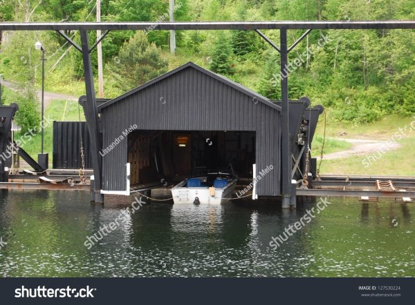 stock-photo-boat-garage-at-laurentians-mountains-lake-in-quebec-canada-127530224.jpg